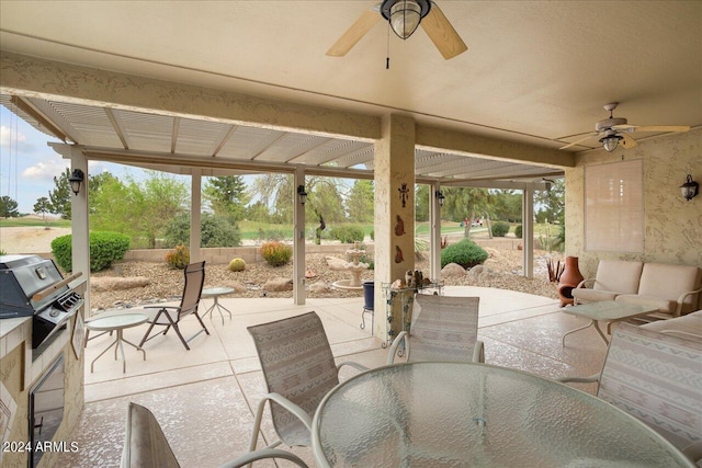 view of patio / terrace featuring a grill and ceiling fan