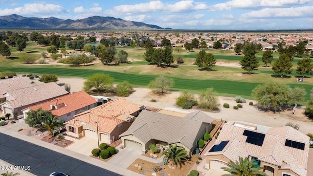 birds eye view of property with a mountain view