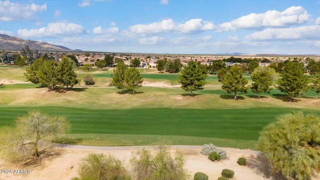 surrounding community featuring a lawn and a mountain view