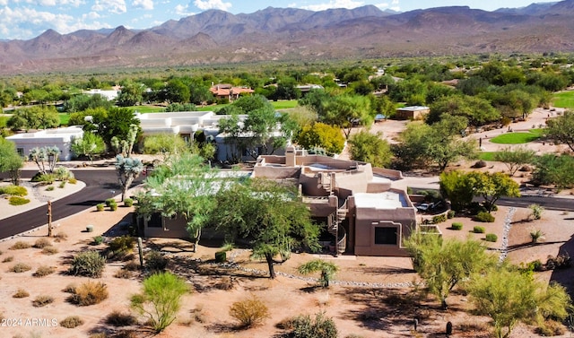 birds eye view of property with a mountain view