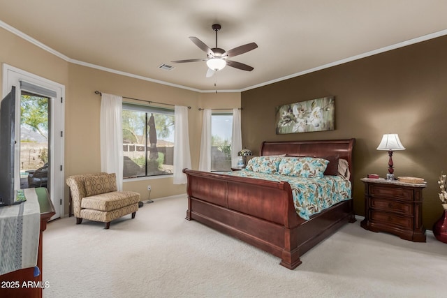 bedroom with multiple windows, ornamental molding, carpet flooring, and visible vents