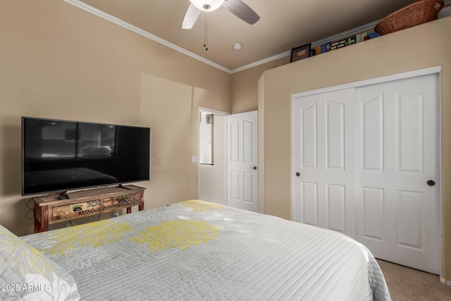 bedroom with carpet floors, a ceiling fan, crown molding, and a closet