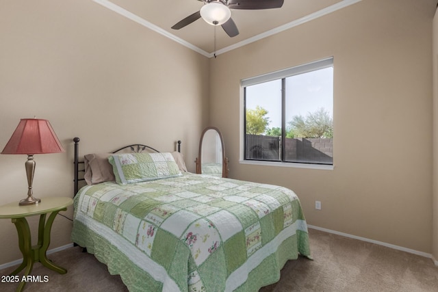 bedroom with baseboards, ornamental molding, carpet, and a ceiling fan