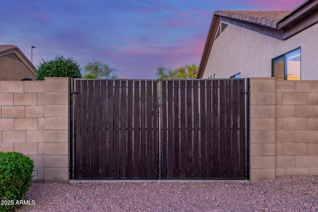 gate at dusk with fence