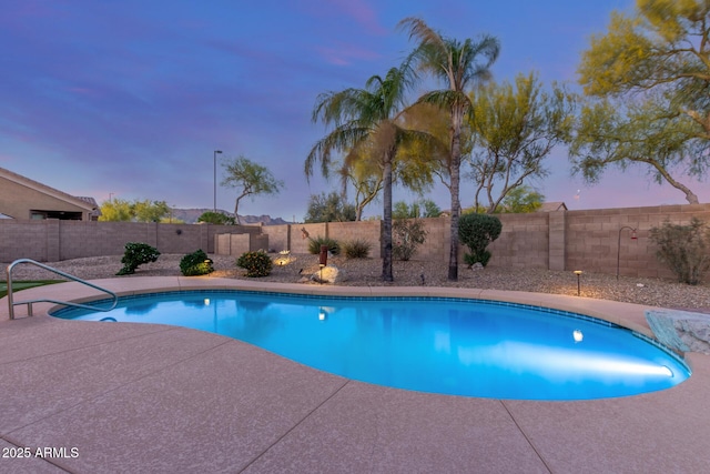view of pool featuring a patio, a fenced in pool, and a fenced backyard
