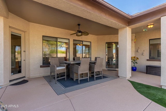 view of patio with a ceiling fan and outdoor dining space