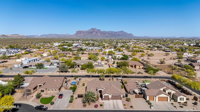 drone / aerial view featuring a residential view and a mountain view