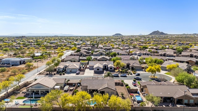 drone / aerial view with a residential view and a mountain view