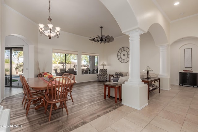 dining area featuring arched walkways, ornate columns, and a wealth of natural light