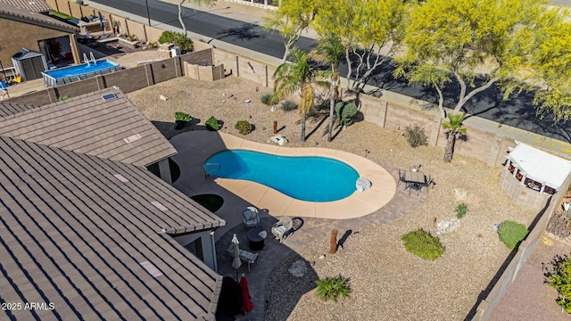 view of pool with a fenced in pool, a patio, and a fenced backyard