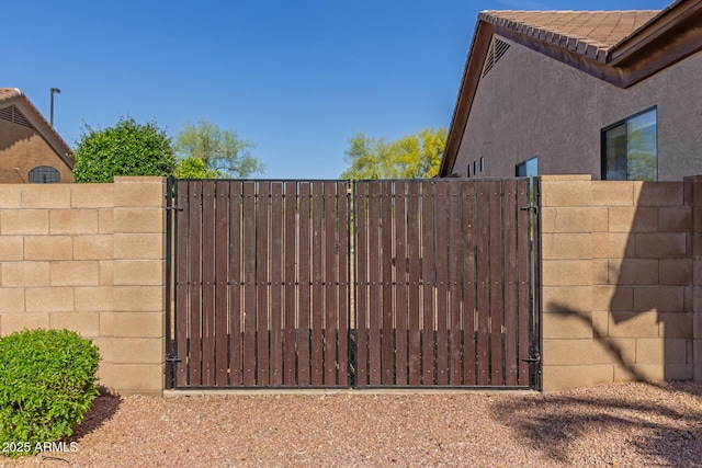 view of gate with fence
