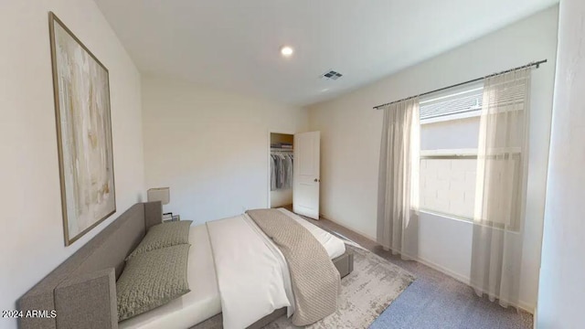 carpeted bedroom featuring a closet