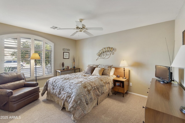 bedroom featuring light colored carpet and ceiling fan