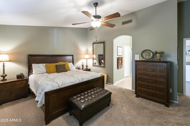 bedroom featuring ceiling fan and light carpet