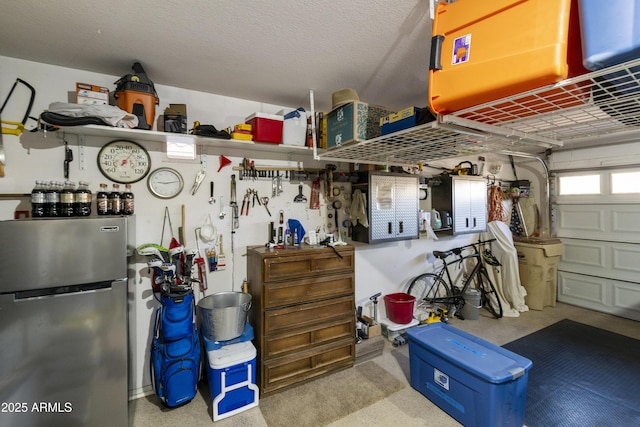 garage with stainless steel fridge and a workshop area