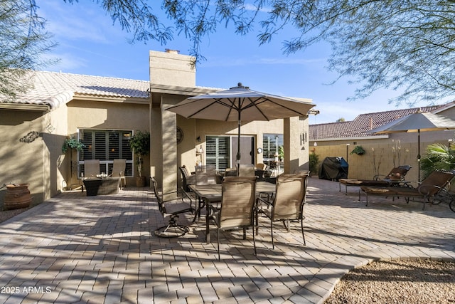 back of property featuring a patio area