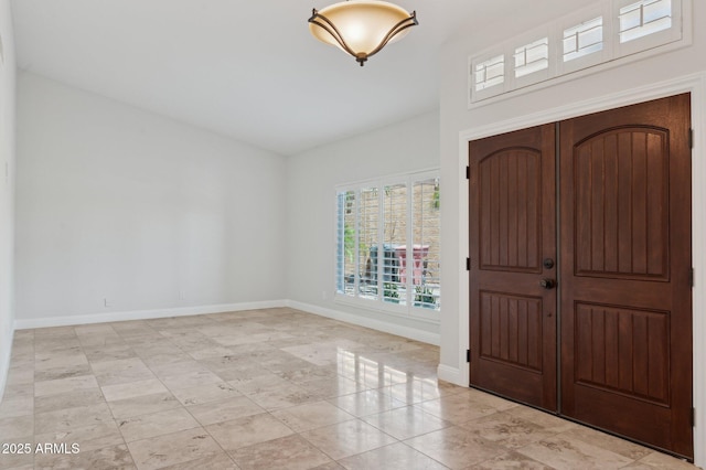 10450 E Terra Dr, Scottsdale, AZ 85258 - foyer with plenty of natural light, baseboards, and light tile patterned floors