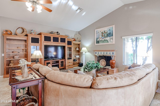 living room featuring ceiling fan and lofted ceiling