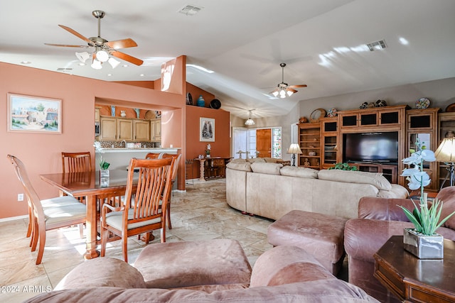 tiled living room featuring ceiling fan and lofted ceiling