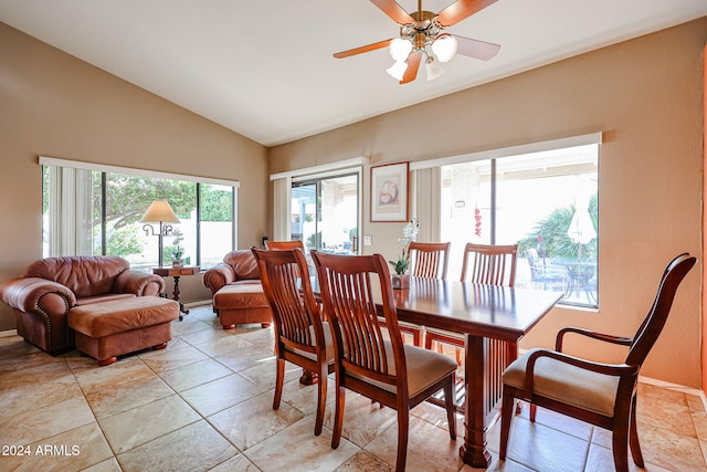 dining room with ceiling fan and lofted ceiling