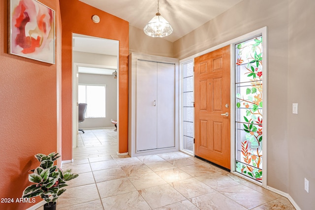 entrance foyer with a notable chandelier