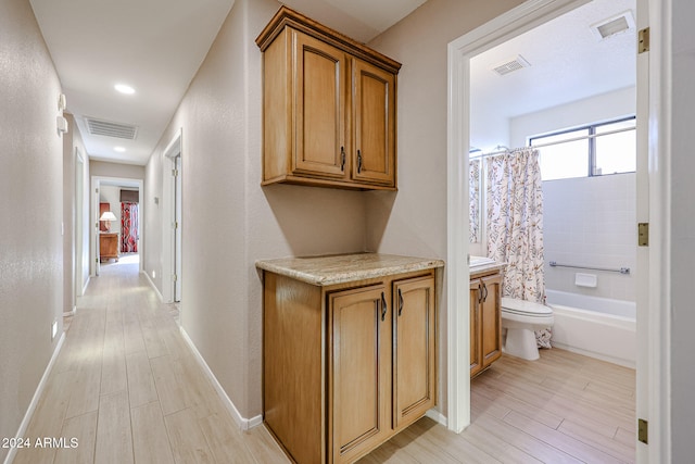 hall with light hardwood / wood-style flooring