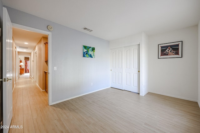 empty room with light wood-type flooring