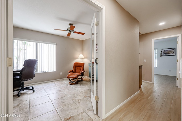 office featuring light hardwood / wood-style flooring and ceiling fan