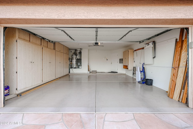 garage featuring gas water heater and a garage door opener