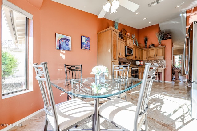 dining room featuring ceiling fan