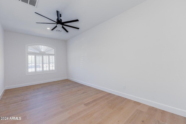 empty room featuring ceiling fan and light wood-type flooring