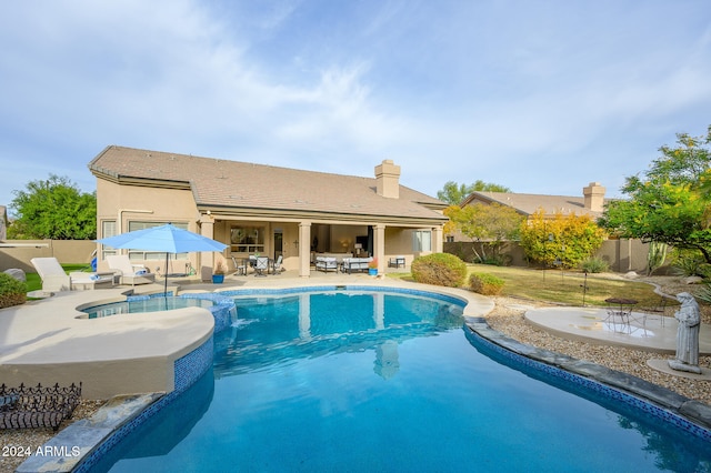 view of swimming pool with a patio