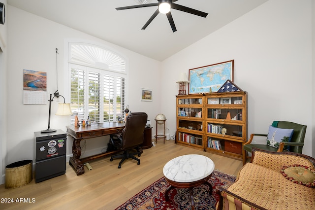 office area with vaulted ceiling, light hardwood / wood-style flooring, and ceiling fan