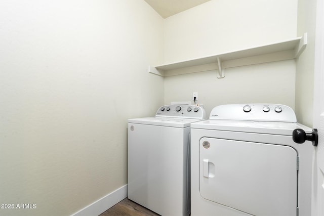 laundry room with dark hardwood / wood-style flooring and separate washer and dryer