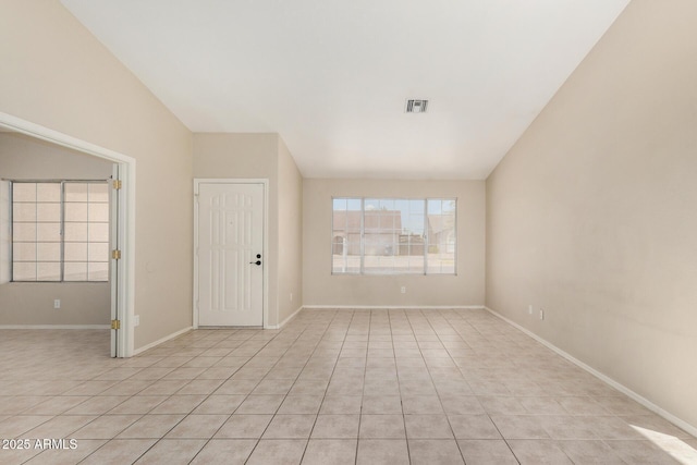 6317 E Colby St, Mesa, AZ 85205 - spare room featuring vaulted ceiling, light tile patterned floors, and baseboards