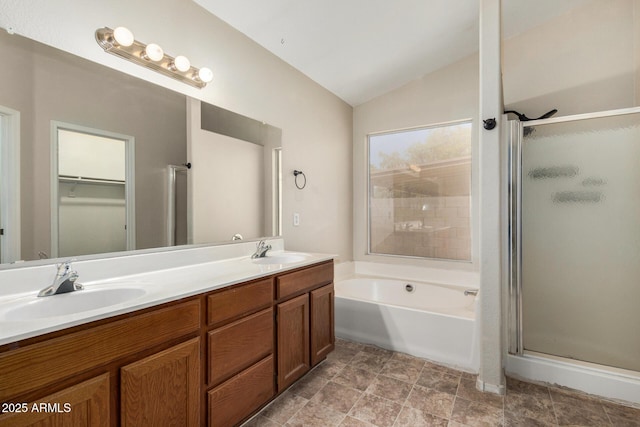 6317 E Colby St, Mesa, AZ 85205 - bathroom featuring a stall shower, lofted ceiling, a bath, double vanity, and a spacious closet