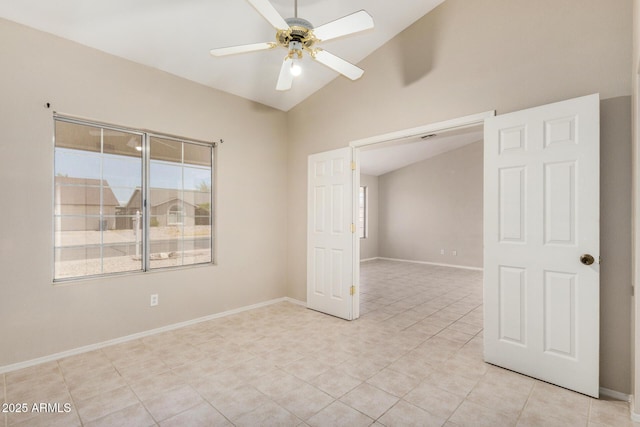 6317 E Colby St, Mesa, AZ 85205 - empty room with healthy amount of natural light, ceiling fan, light tile patterned floors, baseboards, and high vaulted ceiling