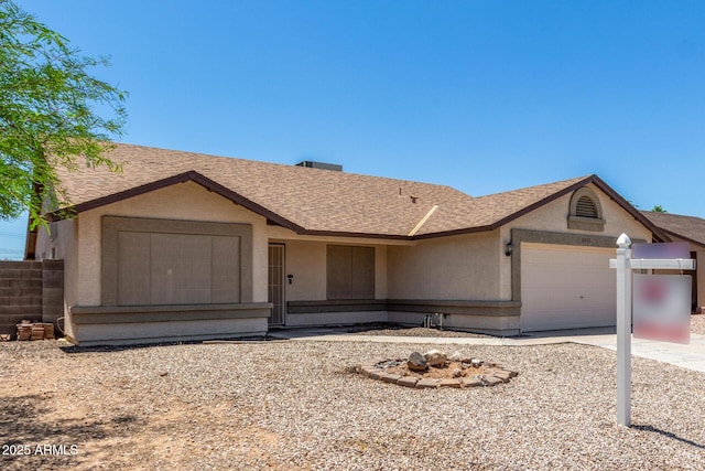 6317 E Colby St, Mesa, AZ 85205 - single story home with an attached garage, roof with shingles, stucco siding, and driveway