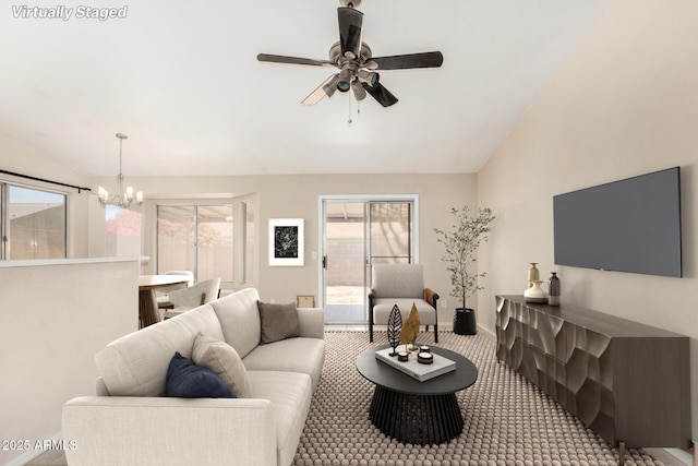 6317 E Colby St, Mesa, AZ 85205 - carpeted living area with lofted ceiling, a chandelier, a ceiling fan, and baseboards