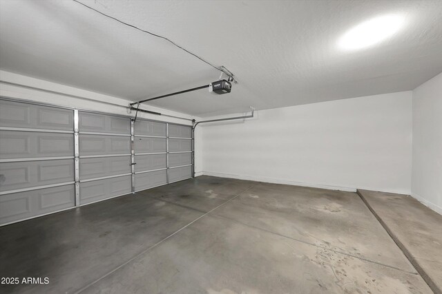 3524 W Alyssa Ln, Phoenix, AZ 85083 - garage featuring baseboards and a garage door opener
