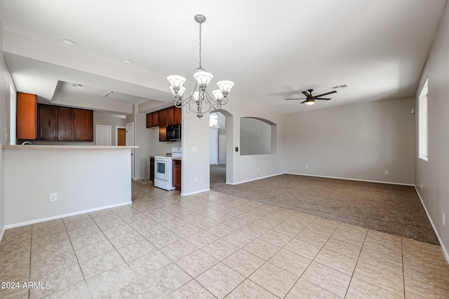 unfurnished living room with arched walkways, light tile patterned floors, light carpet, baseboards, and ceiling fan with notable chandelier