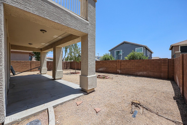 view of yard featuring a patio area and a fenced backyard