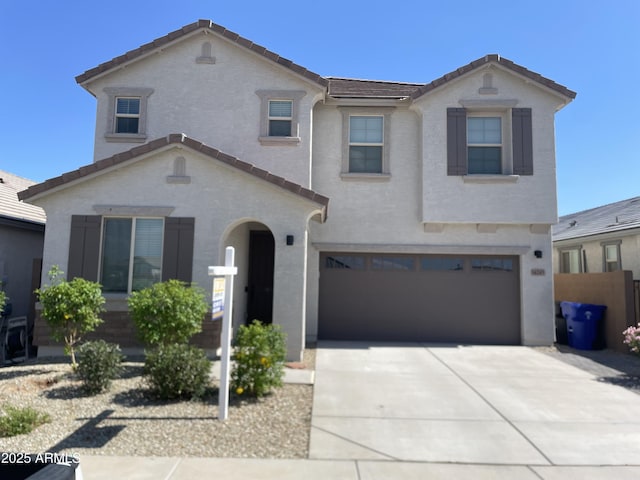 14245 W El Cortez Pl, Surprise, AZ 85387 - view of front of house with a garage, concrete driveway, and stucco siding