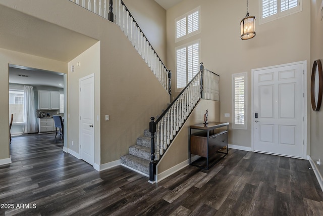 3062 E Cullumber St, Gilbert, AZ 85234 - entryway featuring dark wood-style flooring, stairway, and a high ceiling