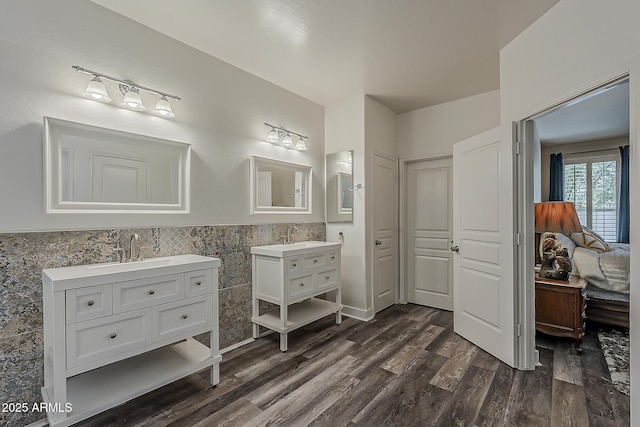 3062 E Cullumber St, Gilbert, AZ 85234 - bathroom with two vanities, wood finished floors, wainscoting, and tile walls