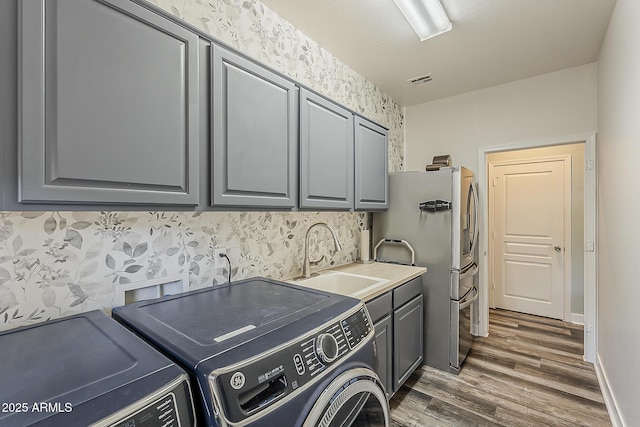 3062 E Cullumber St, Gilbert, AZ 85234 - laundry area featuring cabinet space, washer and dryer, and dark wood finished floors