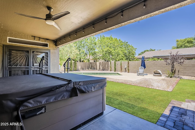 3062 E Cullumber St, Gilbert, AZ 85234 - fenced backyard with a hot tub, a ceiling fan, and a patio