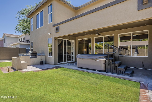 3062 E Cullumber St, Gilbert, AZ 85234 - back of house with a hot tub, exterior kitchen, a patio area, ceiling fan, and stucco siding