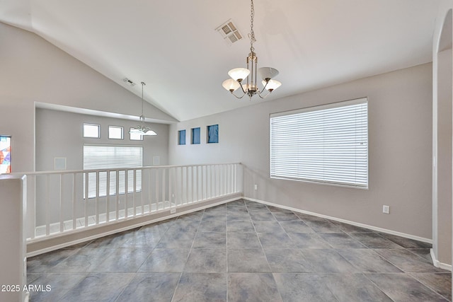 unfurnished room with vaulted ceiling, a chandelier, and baseboards