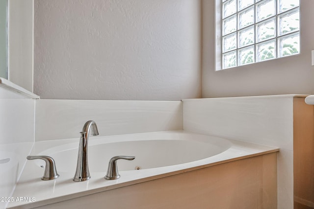 full bath featuring a jetted tub